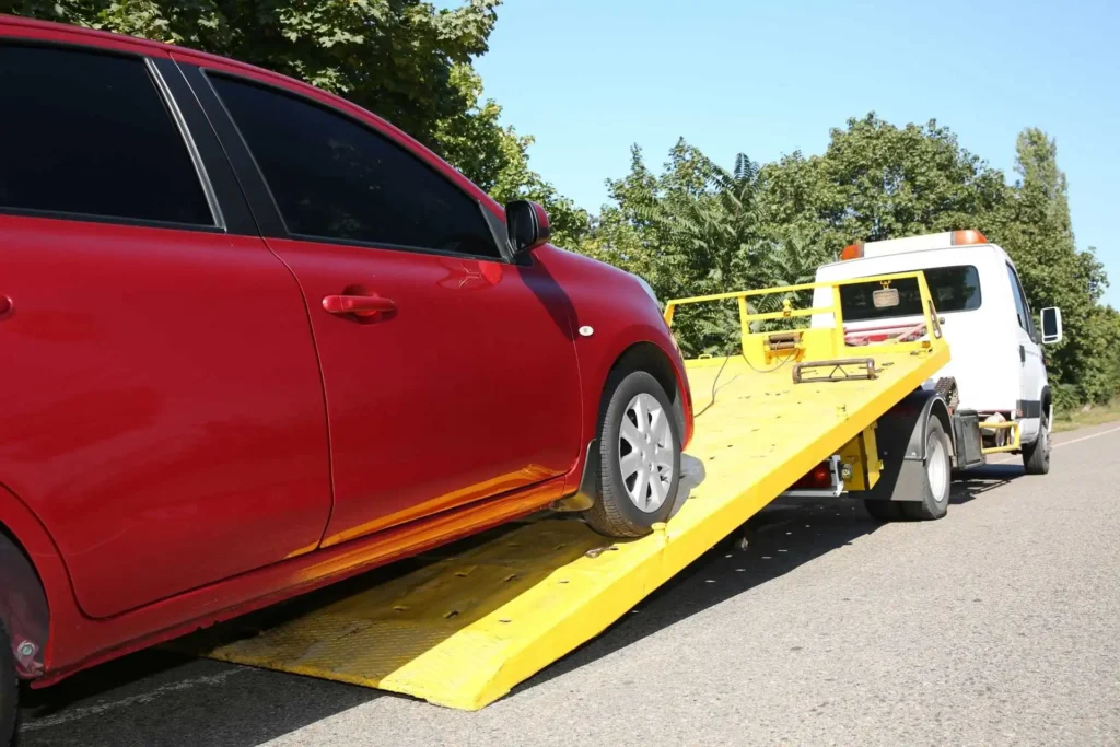 Car is being towed to a vehicle impound tow yard tremont towing | Miami Beach | Tremont Towing | Beach Towing 